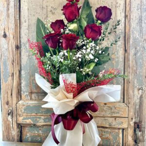 7 rose rosse per dire TI AMO con una bellissima confezione